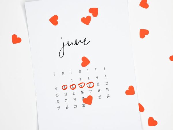 A calendar with circled dates showing a consistent workout schedule.